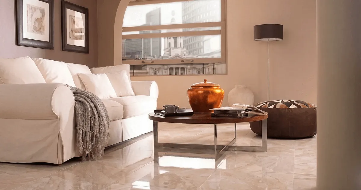 Modern living room with professionally installed marble flooring, a beige sofa, coffee table in Bakersfield, CA